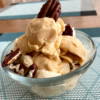 Dairy-free Butter Pecan Frozen Custard topped with bananas and roasted pecans