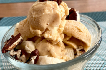 Dairy-free Butter Pecan Frozen Custard topped with bananas and roasted pecans