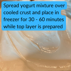 Spread yogurt mixture over cooled crust and place in freezer for 30 - 60 minutes while top layer is prepared